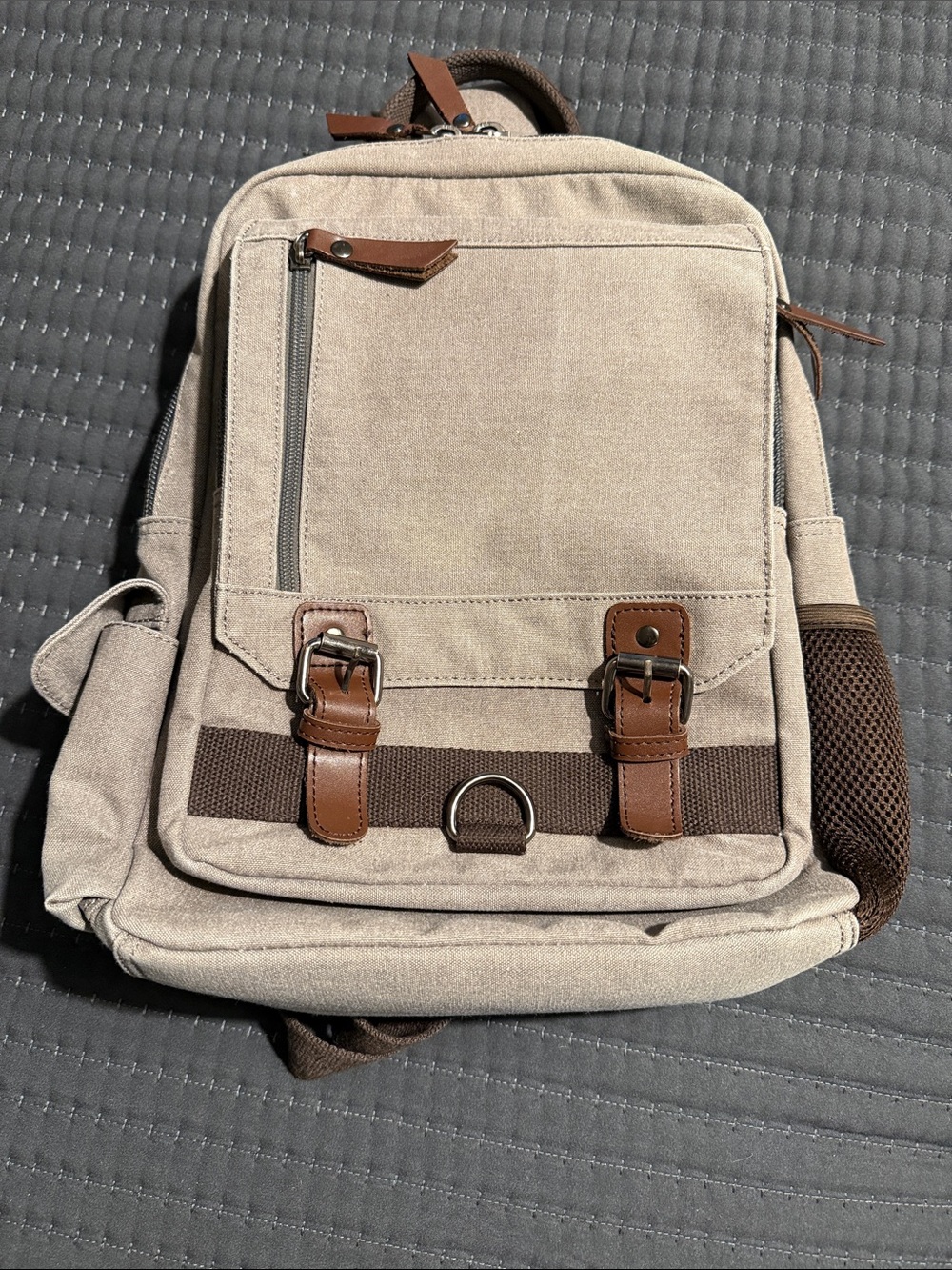 Men's Beige Canvas Backpack with Brown Trim and Buckle Accents